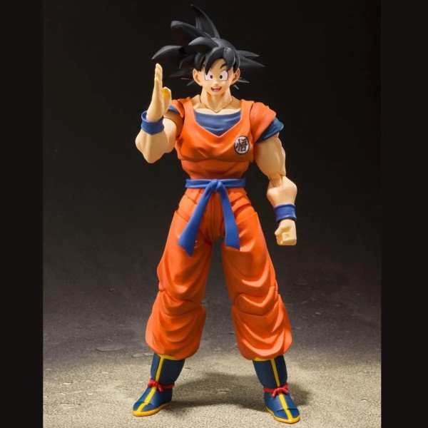 Son Goku S.H. Figuarts en pose “salut” avec sourire, tenue orange et ceinture bleue – Dragon Ball Z (Bandai Spirits).