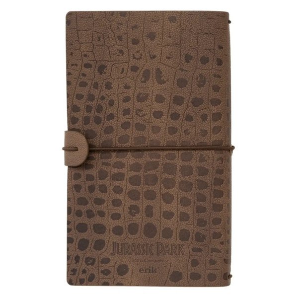 Carnet de voyage Jurassic Park avec couverture texturée effet peau de dinosaure, vue de face.