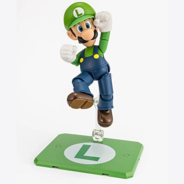 Figurine Luigi S.H. Figuarts de Super Mario en plein saut sur support transparent avec base verte