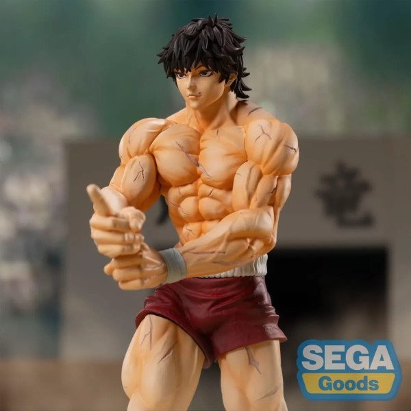 Statuette Baki Hanma vue en buste de trois quarts, muscles marqués, short rouge et bandes grises.
